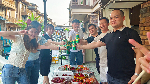 Qi An staff celebration at factory supporting OEM fire door manufacturing